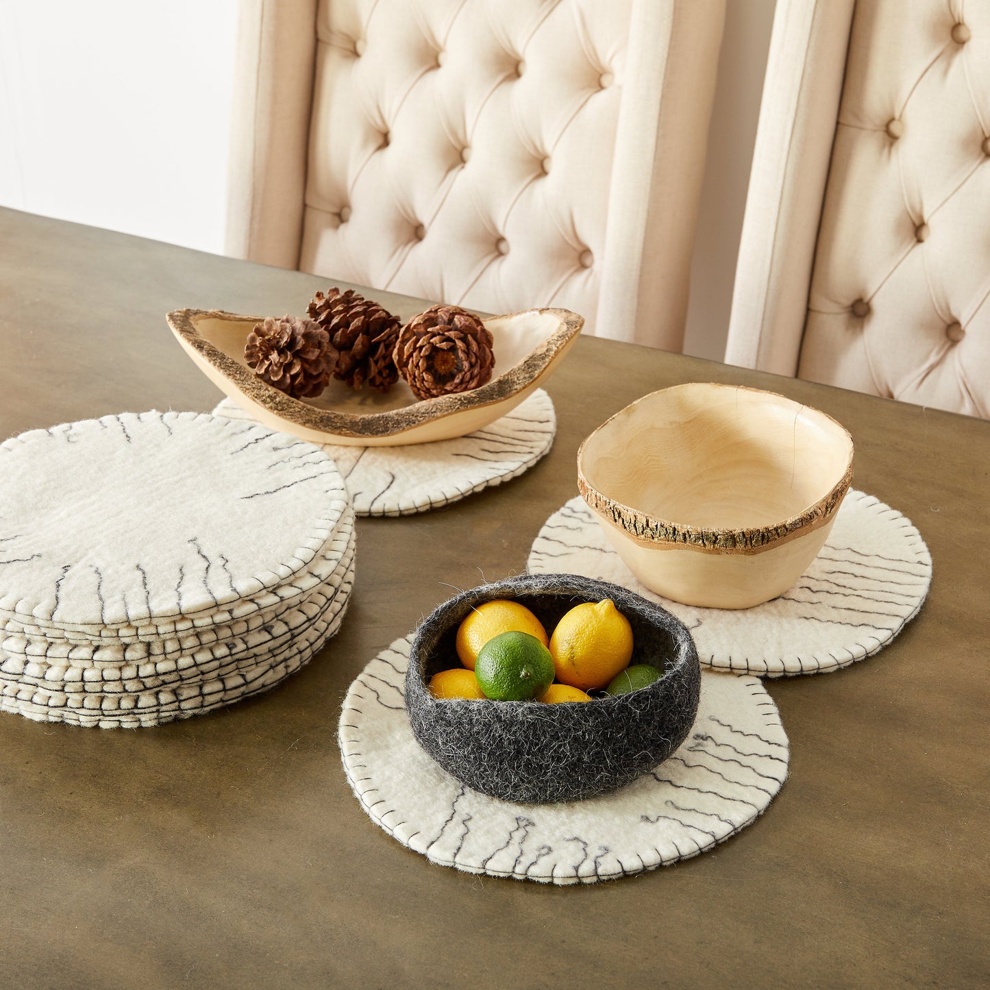white round felted wool trivet