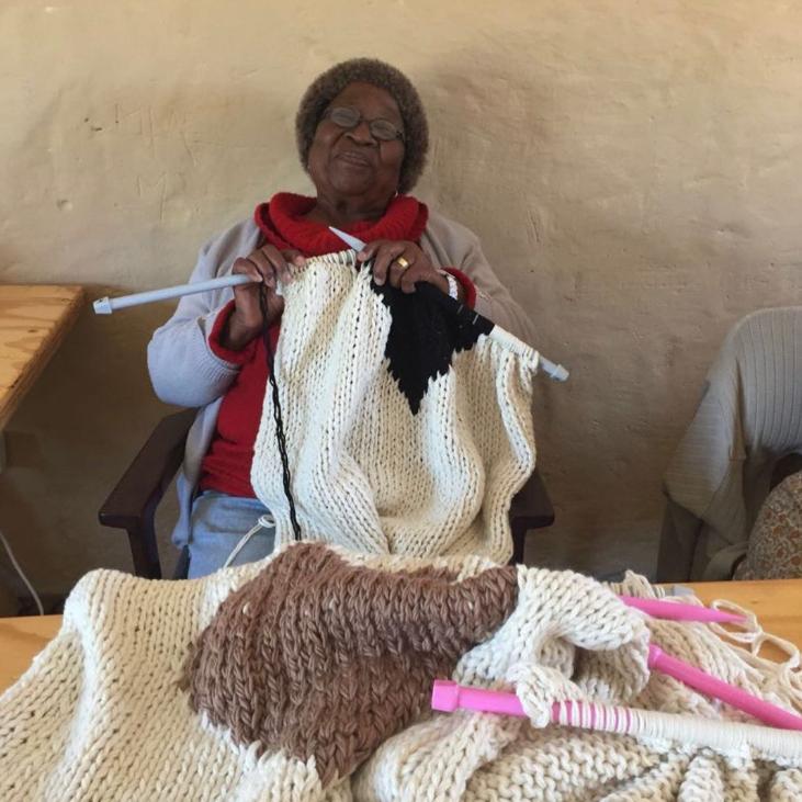 Blankets from Africa is a female-owned and operated community project, supporting women in rural areas by creating a safe working environment in their community. Their dream is to maintain sustainable employment in Karoo communities and to create a positive change for generations to come. Nestled in the enchanting embrace of the Karoo Desert in South Africa, the Blankets from Africa cooperative is more than just home and knitwear – it's a vast project that invites you to immerse yourself in a world where he