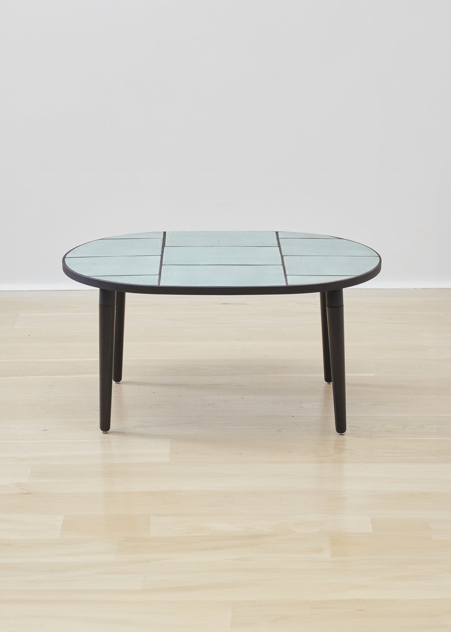 Luxuriously crafted Kanju Wiid Ceramic Oval Table, a centerpiece of modern elegance. Its sleek, oval-shaped ceramic top exudes sophistication, complemented by a robust base that merges durability with contemporary design. Ideal for upscale interiors, this table encapsulates the essence of refined, African-inspired luxury decor.