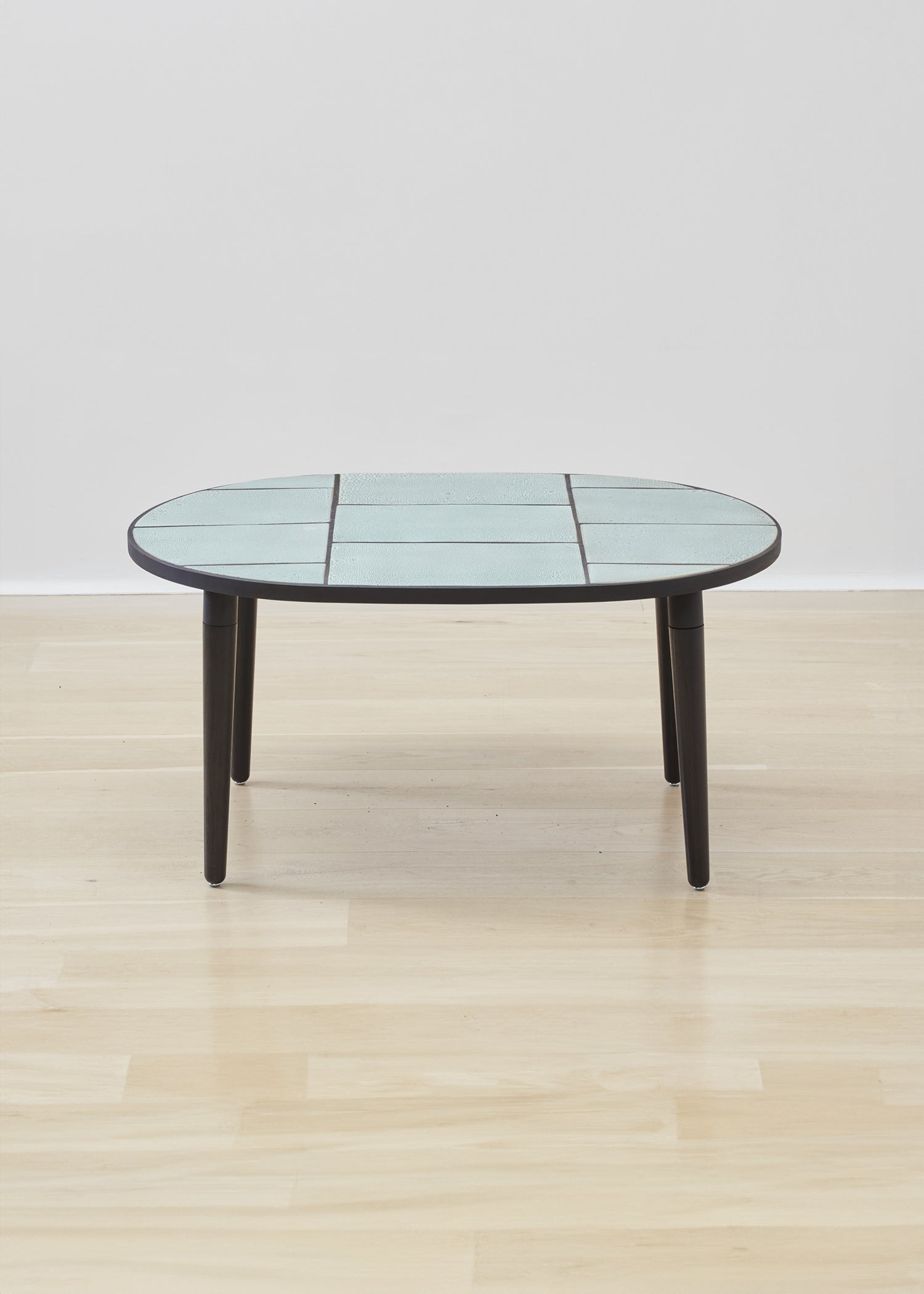 Luxuriously crafted Kanju Wiid Ceramic Oval Table, a centerpiece of modern elegance. Its sleek, oval-shaped ceramic top exudes sophistication, complemented by a robust base that merges durability with contemporary design. Ideal for upscale interiors, this table encapsulates the essence of refined, African-inspired luxury decor.