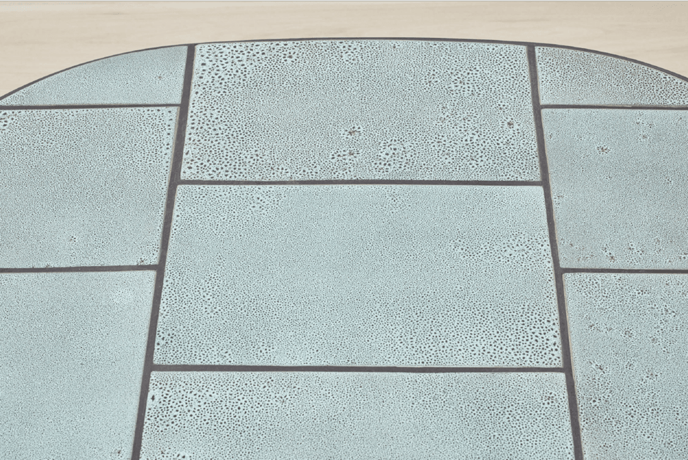 Elegant Kanju Wiid Ceramic Oval Table, a masterpiece of contemporary design with a luxurious twist. Featuring a polished ceramic top in a refined oval shape, this table combines durability with sleek style. Perfect for upscale living and dining areas, it epitomizes the fusion of high-end craftsmanship and African design aesthetics, making it a sought-after piece for sophisticated interiors.