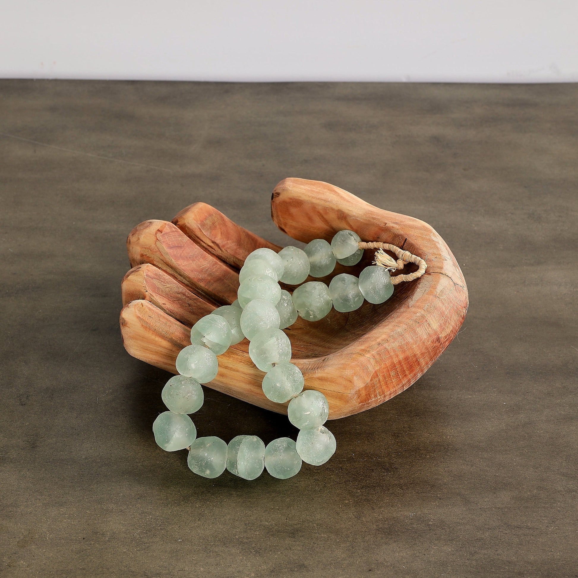 hand-carved Wooden Cupped Hand Bowl Sculpture.