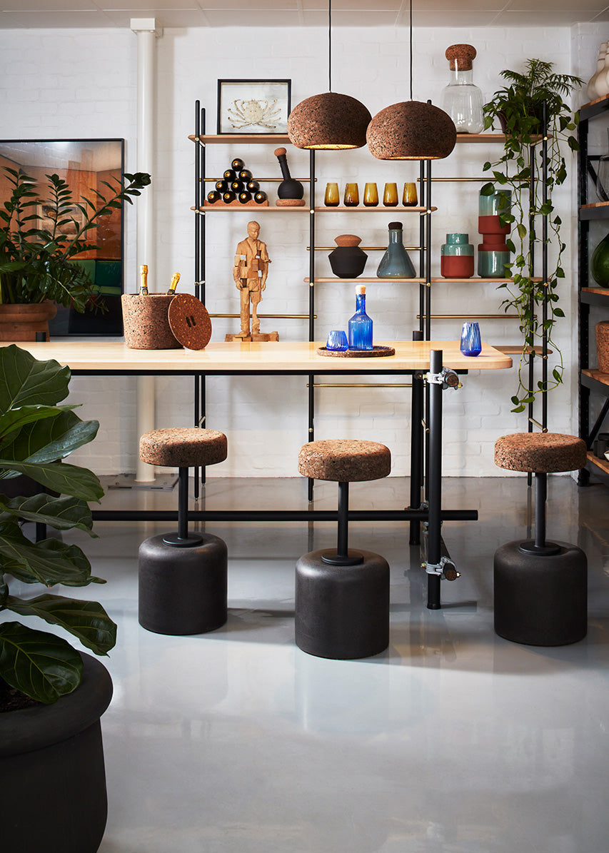 Luxurious Wiid Design Cork Swivel Counter & Bar Stool in sophisticated charcoal grey, featuring a sleek, contemporary design with eco-friendly materials, crafted by renowned South African artisans, exclusively for Kanju's high-end home decor collection.
