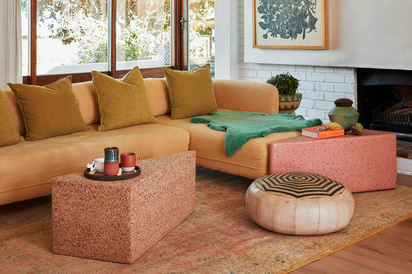 Versatile Kanju Wiid Triangle Cork Seat/Side Table in chic light cork and vibrant pink, merging functionality with modern design. This dual-purpose piece showcases the natural beauty of cork with a playful pink accent, offering a unique, eco-friendly addition to any contemporary space, perfect for minimalist and dynamic interiors.