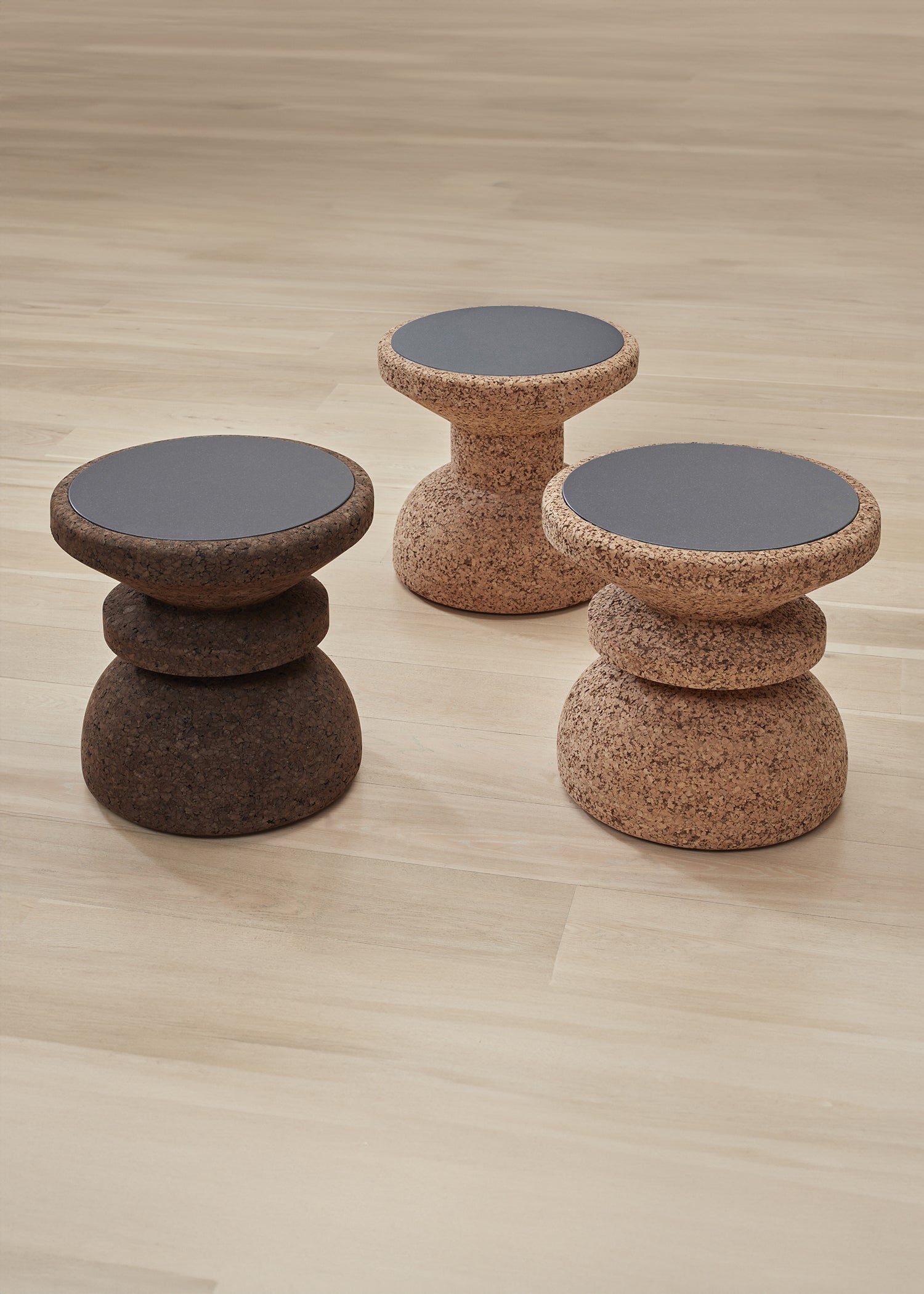 Kanju's Wiid African Cork & Granite Side Table, a masterpiece of luxury design, featuring a harmonious blend of natural cork and polished granite. This exquisite piece reflects the innovative spirit of African craftsmanship, perfect for adding a touch of elegance and sustainability to upscale interiors.
