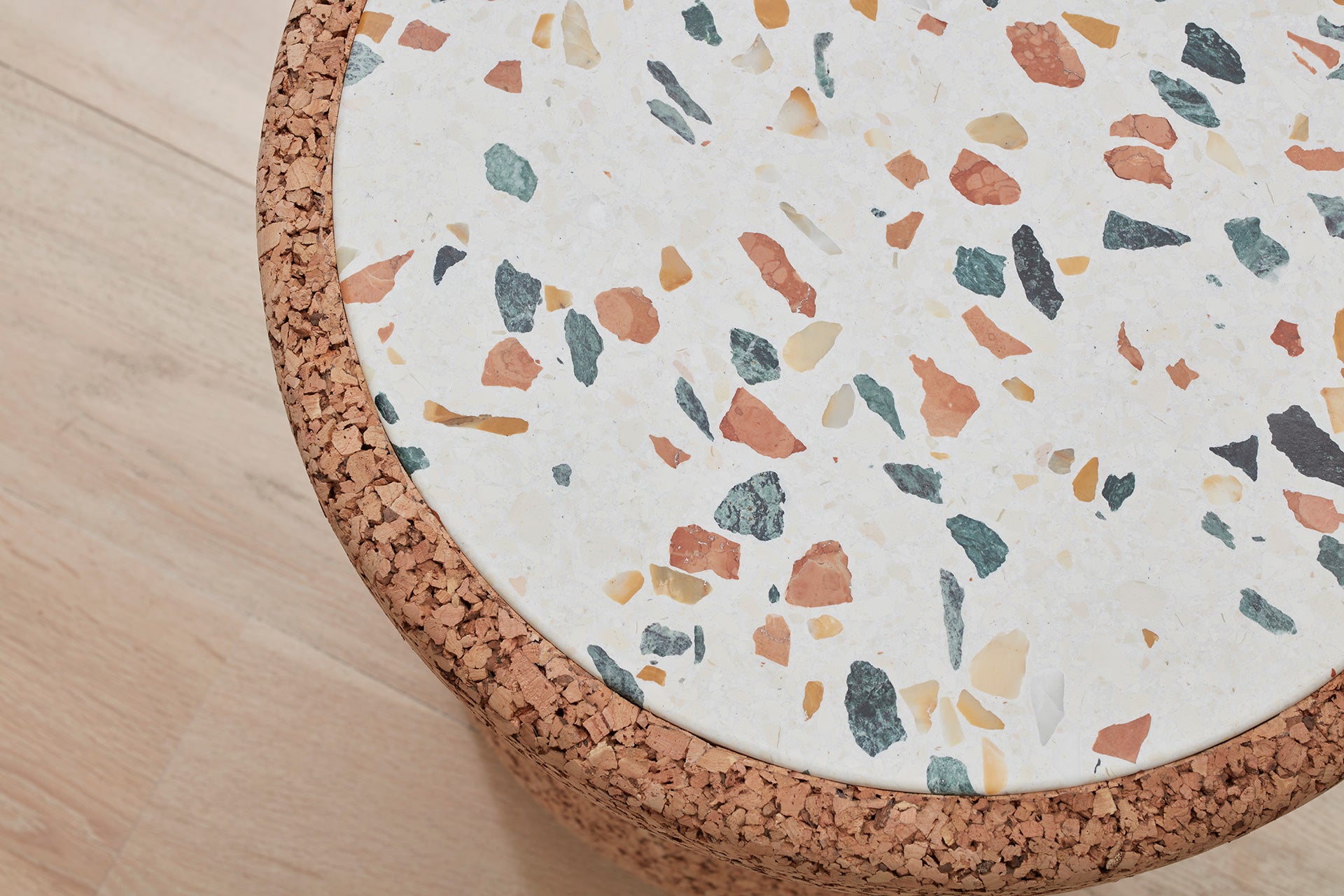 Elegant Kanju Wiid African Cork and Terrazzo Side Table, showcasing a sophisticated blend of sustainable cork and colorful terrazzo. This artisanal piece combines contemporary design with African craftsmanship, ideal for luxury interiors seeking a unique and eco-conscious aesthetic