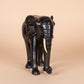 Black elephant figurine on a white background