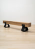 kanju interiors Wiid Design french raw oak and powder matte black stainless steel legs long bench, a masterpiece in luxury home decor. Its design combines timeless elegance with contemporary flair. Perfect for upscale Living rooms, dining room or bedrooms, this table embodies sophisticated style and the fine craftsmanship of African design, appealing to those who appreciate unique, artisanal furniture.