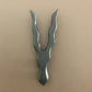 Metallic tool with a unique design on a beige background