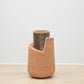 Sophisticated Kanju Wiid Angled Cork Planter, elegantly crafted from sustainable cork with a unique angled design that adds a contemporary touch to luxury home decor. Perfect for showcasing exotic plants, this piece blends innovative South African craftsmanship with eco-friendly luxury