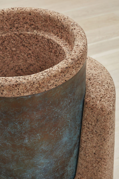 Kanju's Wiid Angled Cork Planter, an epitome of sustainable luxury, featuring a unique angular design that adds a contemporary twist to traditional plant keeping. Crafted from eco-friendly cork, this planter marries functionality with artistic flair, perfect for infusing high-end interiors with a touch of greenery and African-inspired design