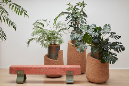 tunning Kanju Wiid Angled Cork Planter, an epitome of luxury eco-design, crafted from sustainable cork with a unique angled silhouette. Perfect for adding a touch of sophisticated greenery to any high-end interior, this piece blends contemporary aesthetics with the timeless appeal of natural materials