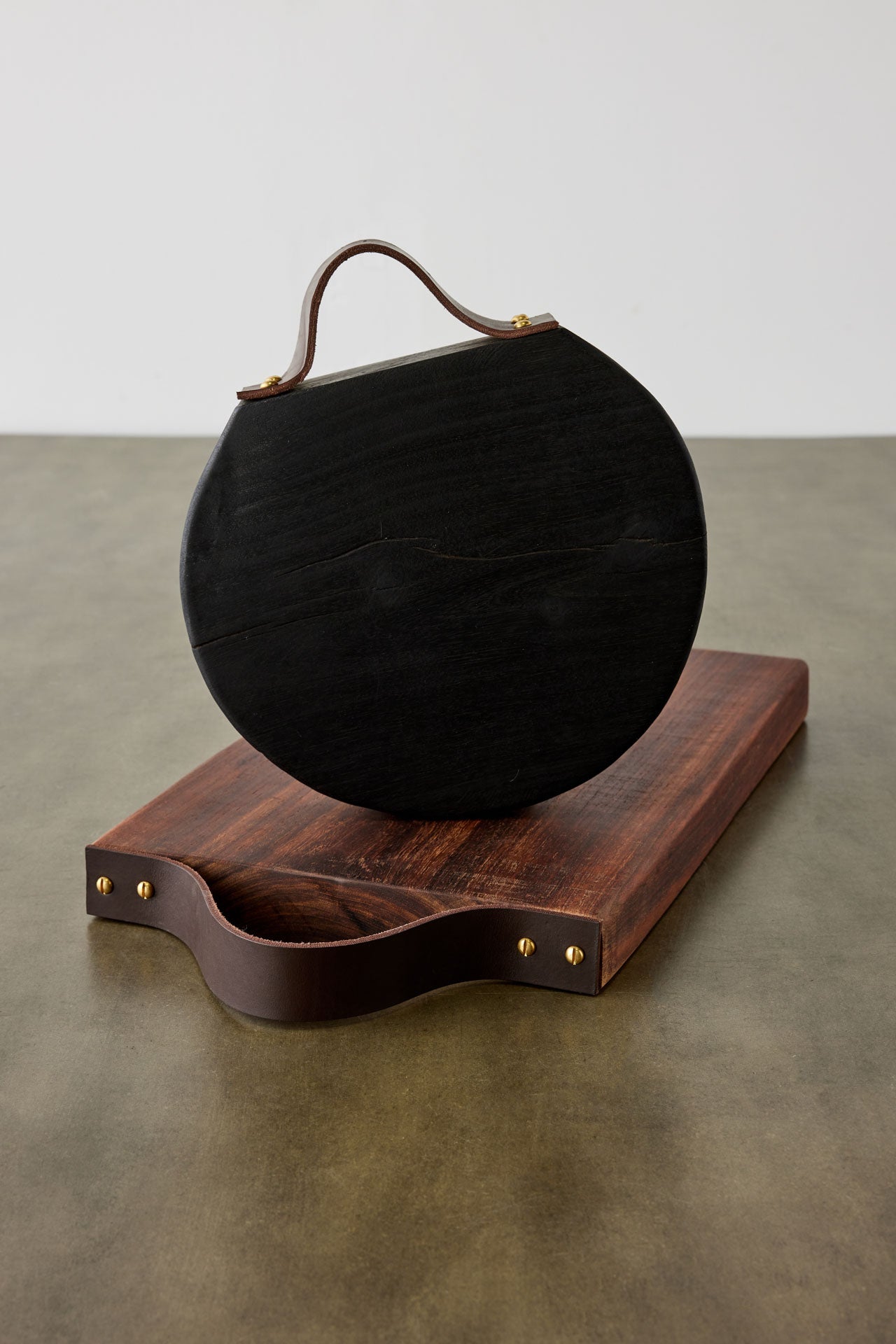 Round Blackened Wood Cutting Board w/ Leather Strap