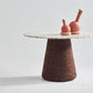 Product image of Kanju's Wiid Terrazzo and Cork Dining Table in Dark Cork, showcasing its sleek, modern design. The table features a luxurious terrazzo top with specks of vibrant colors, perfectly complemented by the rich, eco-friendly dark cork base. This piece epitomizes contemporary elegance, blending innovative materials with functional artistry, ideal for sophisticated dining spaces