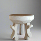 Decorative bowl with wooden top and white base on a white background
