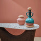 kanju interiors Wiid Design African Cork and terrazzo narrow table, console table or slim coffee table in a dark shade of cork, combining contemporary elegance with eco-friendly materials. Offering a stylish and sustainable choice for modern interiors seeking a splash of color and minimalist design.