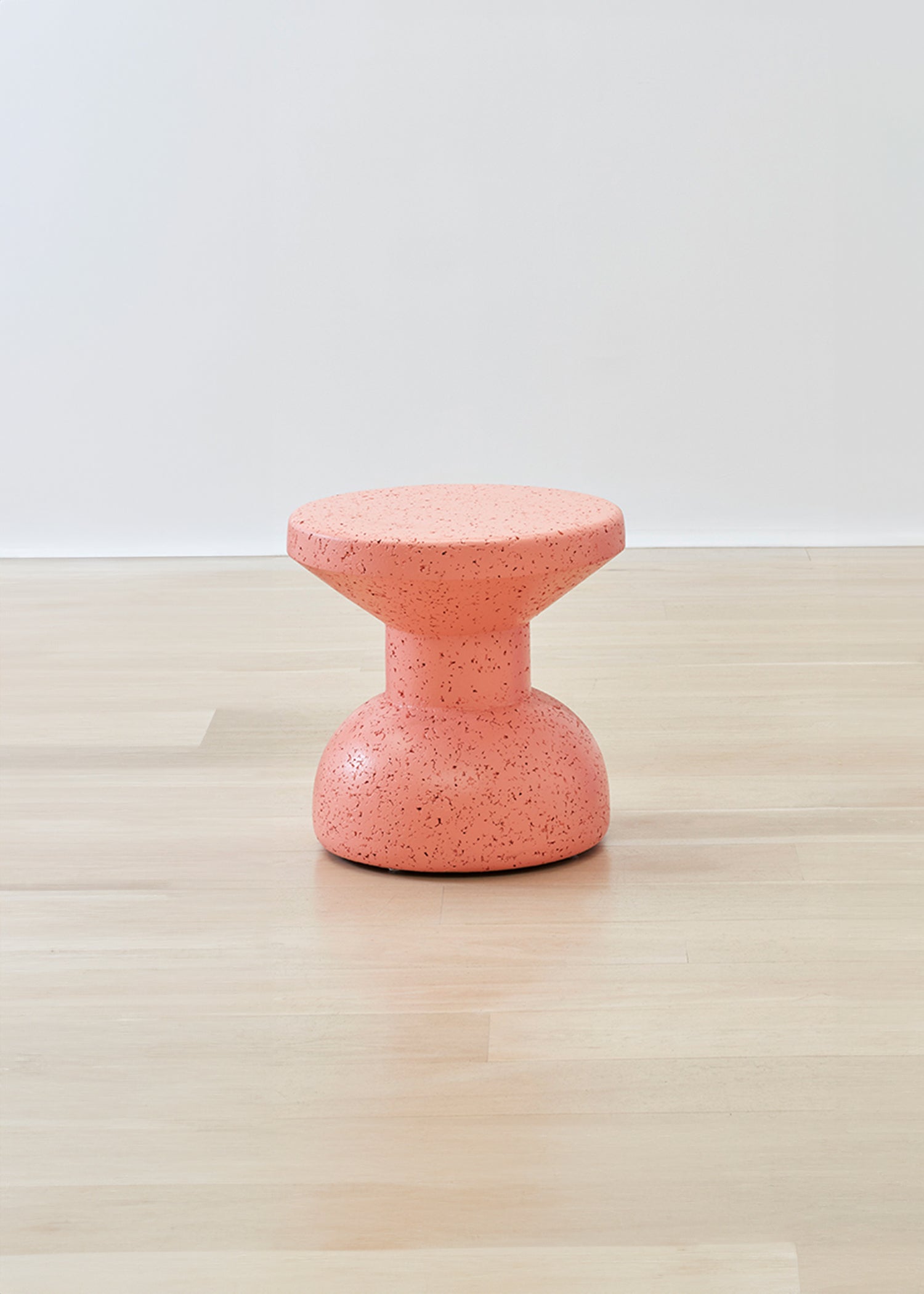 Striking Kanju Wiid Painted African Slim Cork Stool in a vibrant coral hue, blending sleek design with eco-friendly innovation. This slim stool's bold color and refined silhouette offer a modern twist on traditional craftsmanship, ideal for interiors seeking a splash of color and sustainable elegance.