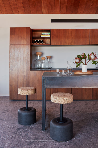 Luxurious Kanju Wiid Design Cork Swivel Counter & Bar Stool in sophisticated charcoal grey, showcasing innovative South African design with eco-friendly materials, perfect for the discerning homeowner seeking a blend of contemporary elegance and sustainable luxury.