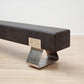 kanju interiors Wiid Design charcoal concrete bench, powder matte black stainless steel legs or polished steel legs, a masterpiece in luxury home decor. Its design combines timeless elegance with contemporary artistic flair. Perfect for upscale Living rooms, dining room or bedrooms, this table embodies sophisticated style and the fine craftsmanship of African design, appealing to those who appreciate unique, artisanal furniture.