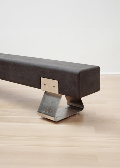 kanju interiors Wiid Design charcoal concrete bench, powder matte black stainless steel legs or polished steel legs, a masterpiece in luxury home decor. Its design combines timeless elegance with contemporary artistic flair. Perfect for upscale Living rooms, dining room or bedrooms, this table embodies sophisticated style and the fine craftsmanship of African design, appealing to those who appreciate unique, artisanal furniture.