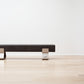 kanju interiors Wiid Design concrete benches, powder matte black stainless steel legs or polished steel legs, a masterpiece in luxury home decor. Its design combines timeless elegance with contemporary artistic flair. Perfect for upscale Living rooms, dining room or bedrooms, this table embodies sophisticated style and the fine craftsmanship of African design, appealing to those who appreciate unique, artisanal furniture.