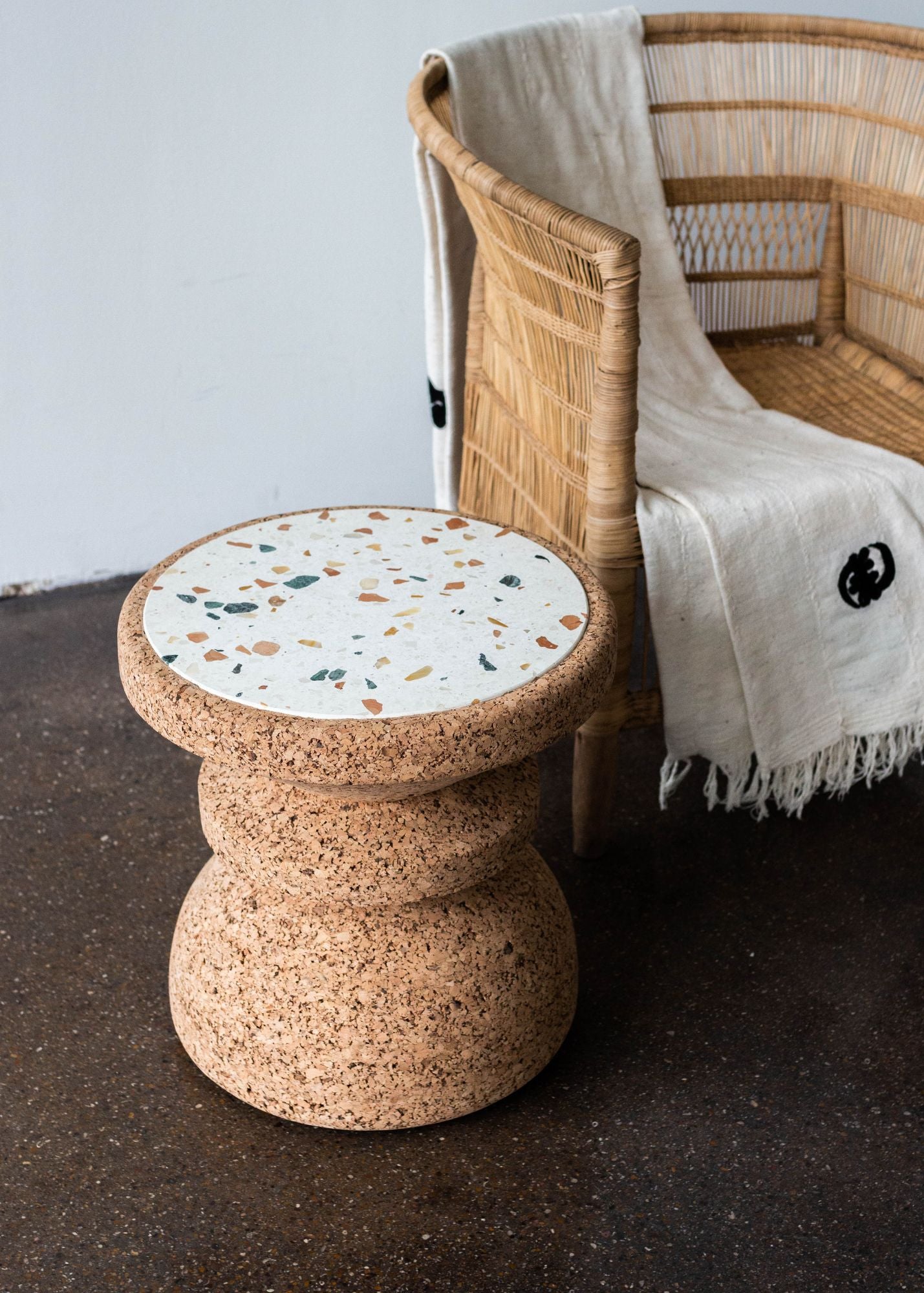 Kanju's Wiid African Cork and Terrazzo Side Table, an epitome of modern luxury and sustainability. This elegant piece combines the warmth of natural cork with the chic, speckled appeal of terrazzo, showcasing a unique blend of African-inspired design and contemporary sophistication, ideal for upscale, eco-conscious interiors.