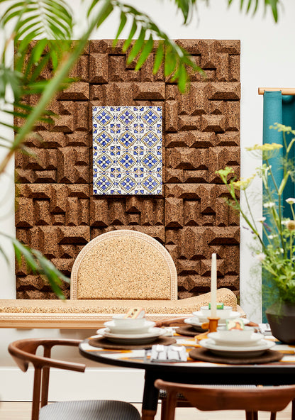 Luxurious Kanju Interiors dining space, adorned with Wiid Design Angular Cork Wall Panels and an exquisite Moroccan-inspired tile inlay, complemented by verdant plant accents and sophisticated table settings on a premium walnut table