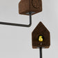 Intimate close-up of the Luxury Wiid Design Bird House, emphasizing the eco-friendly dark cork material paired with a solid concrete base. This image showcases the birdhouse's premium texture and architectural quality, reflecting its sustainable design and robust construction, perfect for adding a touch of luxury to eco-conscious outdoor spaces.