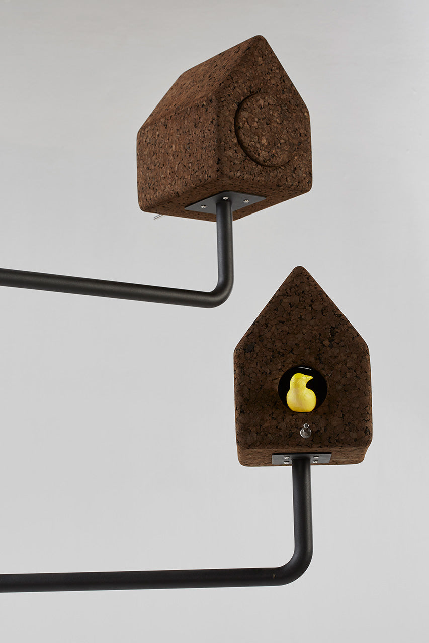 Intimate close-up of the Luxury Wiid Design Bird House, emphasizing the eco-friendly dark cork material paired with a solid concrete base. This image showcases the birdhouse's premium texture and architectural quality, reflecting its sustainable design and robust construction, perfect for adding a touch of luxury to eco-conscious outdoor spaces.