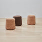 kanju interiors Wiid Design cork end table or stool, a masterpiece in luxury home decor. Its design combines timeless elegance with contemporary flair. Perfect for upscale Living rooms, dining room or bedrooms, this stool embodies sophisticated style and the fine craftsmanship of African design, appealing to those who appreciate unique, artisanal furniture.