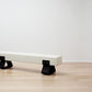 kanju interiors Wiid Design concrete benches, powder matte black stainless steel legs or polished steel legs, a masterpiece in luxury home decor. Its design combines timeless elegance with contemporary artistic flair. Perfect for upscale Living rooms, dining room or bedrooms, this table embodies sophisticated style and the fine craftsmanship of African design, appealing to those who appreciate unique, artisanal furniture.