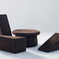 Kanju presents a stylish duo: the Wiid Cork Low Table and Wiid Triangle Cork Table/Seat, both in elegant dark cork. This image captures their versatility and modern design, highlighting the sustainable dark cork's rich texture. Perfect for contemporary spaces, these pieces offer eco-friendly sophistication and multi-functional appeal, blending seamlessly with any decor.