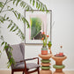 Stylishly arranged image of Kanju's Wiid Green Banded Tall African Cork Side Tables, showcasing the unique Stacked and Ringed designs. This setting highlights how each table brings its own character to a space, with vibrant green bands complementing the natural cork texture. Perfect for illustrating the blend of modern design and sustainability in upscale home decor.