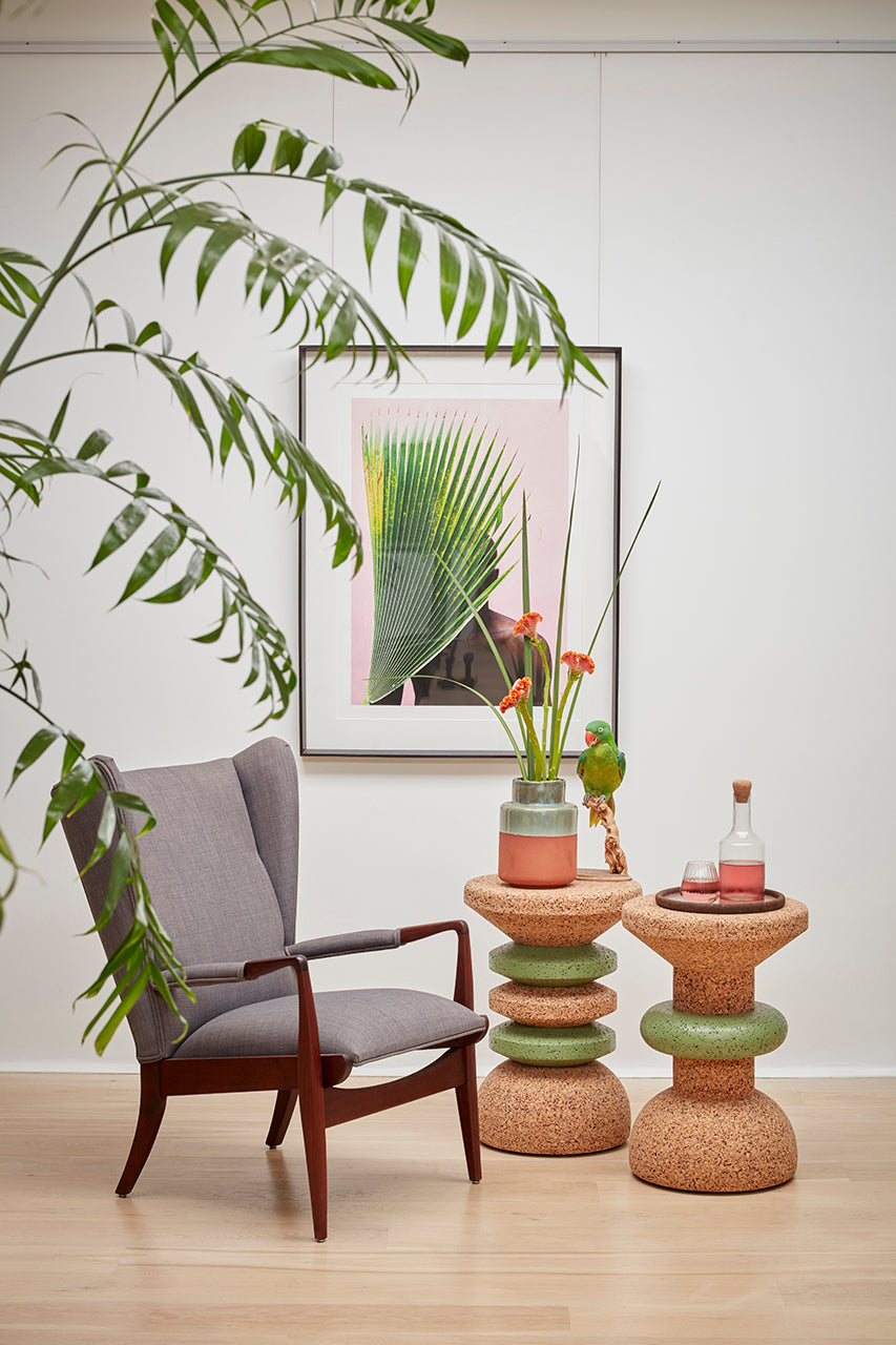 Stylishly arranged image of Kanju's Wiid Green Banded Tall African Cork Side Tables, showcasing the unique Stacked and Ringed designs. This setting highlights how each table brings its own character to a space, with vibrant green bands complementing the natural cork texture. Perfect for illustrating the blend of modern design and sustainability in upscale home decor.