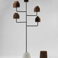 Showcasing the luxury Wiid Design Bird House, this eco-friendly masterpiece combines dark cork with a durable concrete base for a perfect blend of natural elegance and modern durability, with the Wiid African Low Cork stool in dark cork. Designed for discerning nature lovers, this birdhouse not only provides a safe haven for birds but also serves as a sophisticated outdoor decor piece, reflecting a commitment to sustainability and high-end design