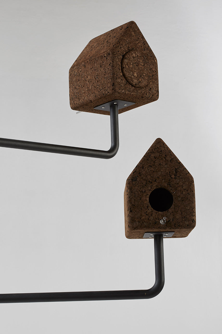 Close-up detail of the Luxury Wiid Design Bird House, highlighting its eco-friendly dark cork and durable concrete base. This image captures the exquisite texture and craftsmanship, showcasing the seamless integration of sustainable materials into a luxury outdoor decor piece. Perfect for enhancing gardens with a touch of elegance while supporting environmental sustainability