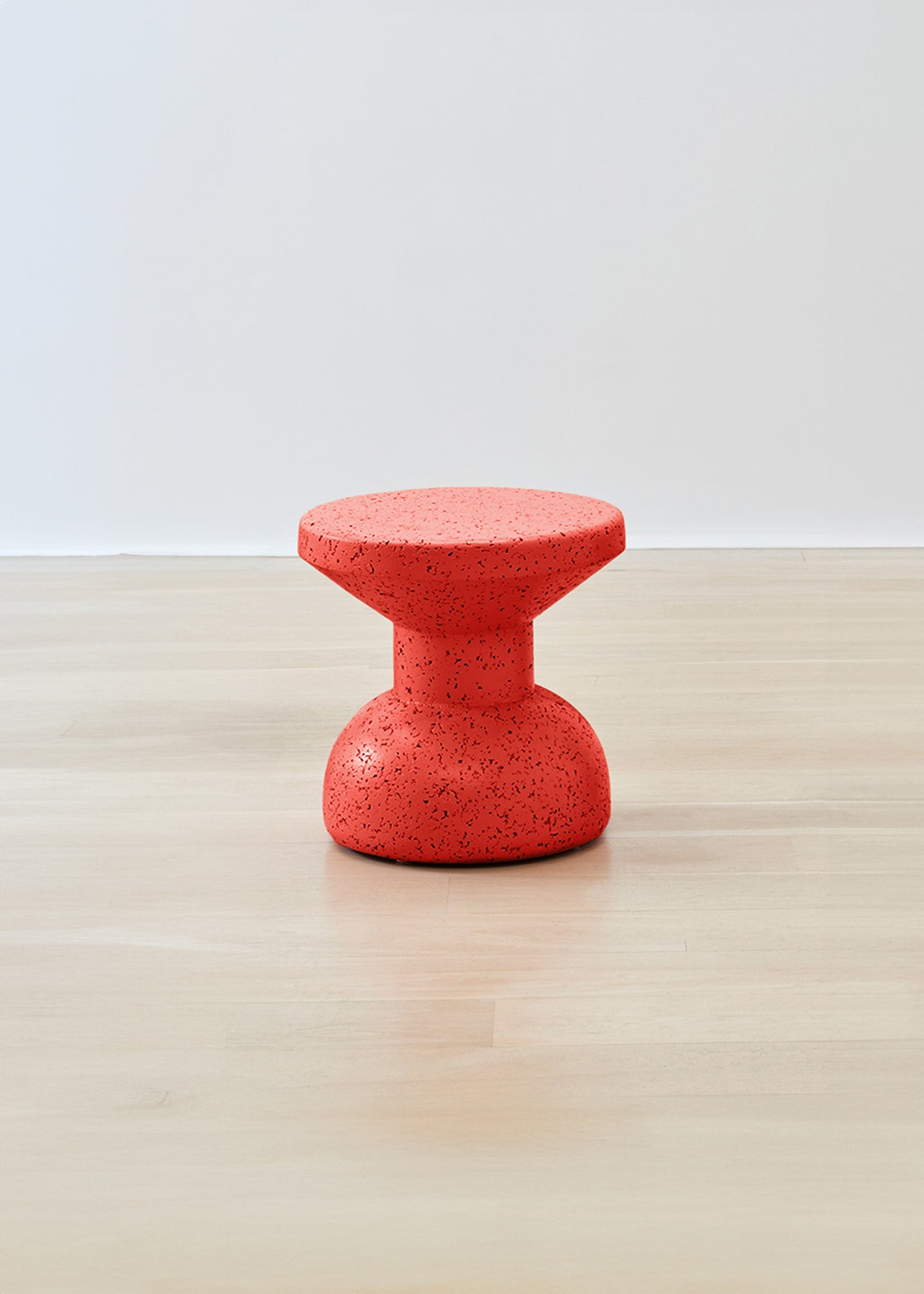 Sleek Kanju Wiid Painted African Slim Cork Stool in a rich red hue, embodying a fusion of contemporary design and sustainability. This slim-profile stool highlights the elegance of cork with a vibrant red finish, making it an ideal choice for modern interiors looking for a touch of bold, eco-friendly sophistication.