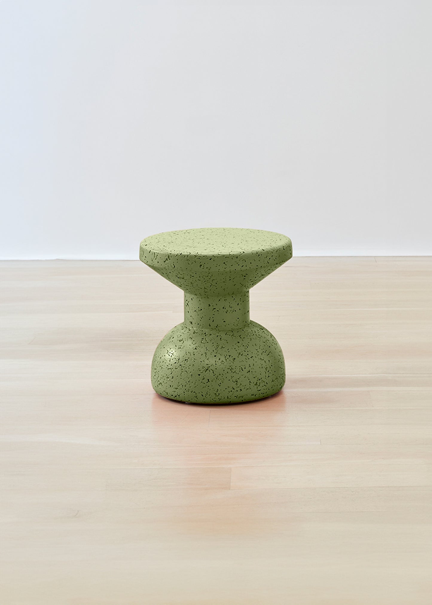 Vibrant Kanju Wiid Painted African Slim Cork Stool in a refreshing green shade, marrying eco-friendly materials with sleek design. This stool's slender silhouette and lively color make it a perfect addition to any space seeking a pop of natural vibrancy coupled with modern, sustainable craftsmanship