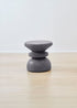 Contemporary Kanju Wiid Painted African Stacked Cork Stool in a sophisticated grey, blending modern design with sustainable practices. This unique stool features a layered cork construction, offering a minimalist yet striking addition to eco-conscious living spaces, reflecting the elegance of African craftsmanship.