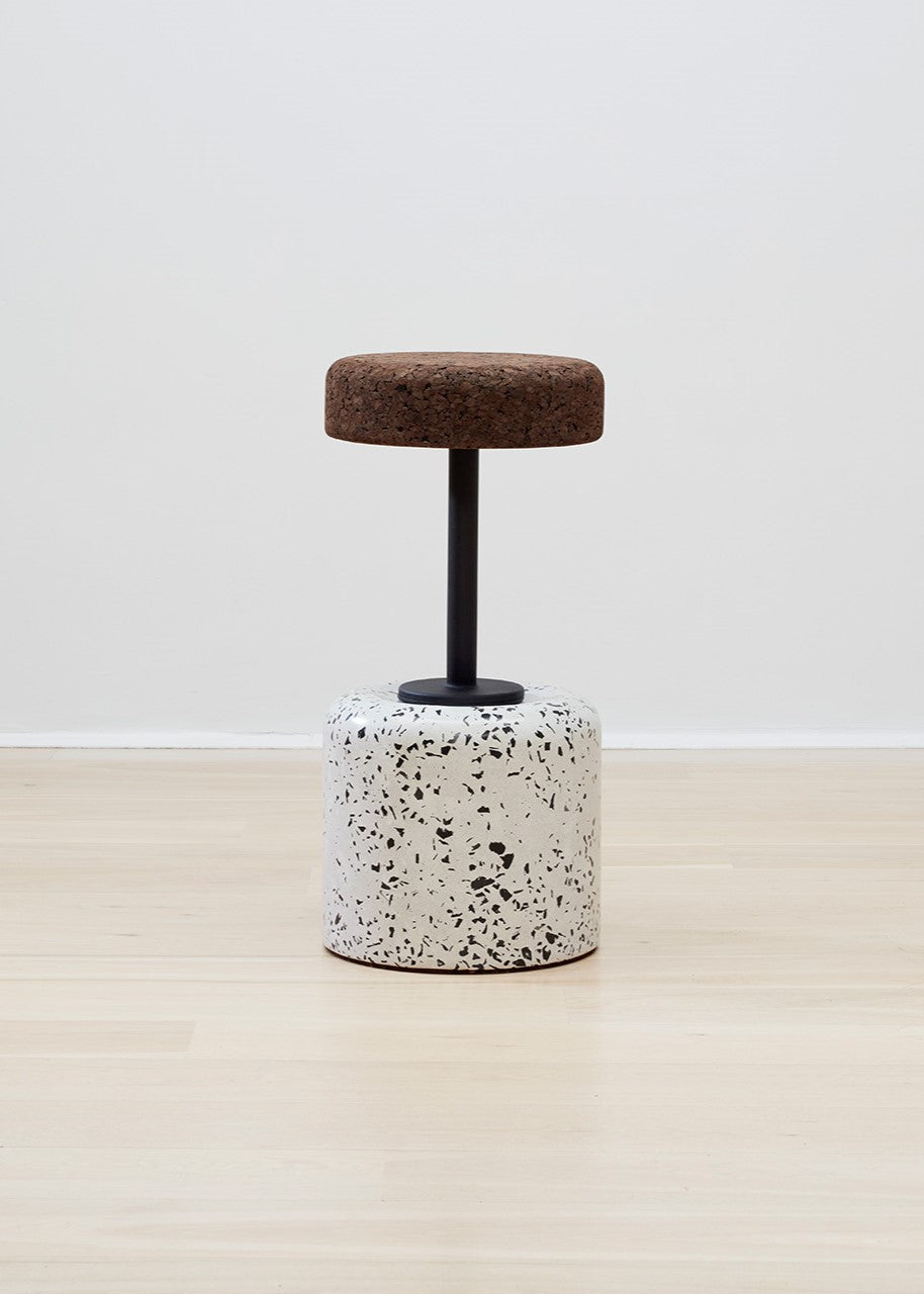 Showcasing the Wiid Swivel Cork and Concrete Bar Stools with a chic Terrazzo Base and Dark Cork Seat, blending durability with style. This innovative design by Wiid integrates the earthy texture of dark cork with the solid stability of a concrete and terrazzo base, creating a visually striking and sustainable seating option for contemporary bars and kitchens.