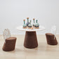 Kanju's exclusive dining set featuring the Wiid Terrazzo and Cork Dining Table in Dark Cork alongside matching Wiid Terrazzo and Cork Dining Chairs, all by Wiid Design. This cohesive ensemble combines the natural elegance of dark cork with the artistic flair of terrazzo, offering a sustainable yet luxurious dining experience. The set exemplifies modern craftsmanship, perfect for those seeking a unique, eco-friendly addition to their dining spaces.