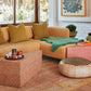 Versatile Kanju Wiid Triangle Cork Seat/Side Table in chic light cork and vibrant pink, merging functionality with modern design. This dual-purpose piece showcases the natural beauty of cork with a playful pink accent, offering a unique, eco-friendly addition to any contemporary space, perfect for minimalist and dynamic interiors.