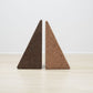Versatile Wiid Triangle Cork Table/Seat by Kanju, available in both dark and light cork finishes, blending functionality with innovative design. This image showcases the dual-purpose piece's sleek geometric shape and the natural contrast between the rich, deep hue of dark cork and the serene, subtle tone of light cork. Perfect for eco-conscious interiors seeking flexible, stylish, and sustainable furniture options.