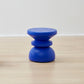 Kanju's Wiid Painted African Stacked Cork Stool in a deep blue, exemplifying a blend of modern design and sustainability. The layered cork construction is highlighted by the rich blue finish, offering a unique, eco-friendly seating solution that adds a touch of sophistication and bold color to any space.